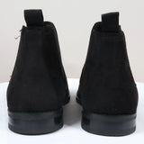 Svarta slip-on-stövlar med foder i mocka och läder för män