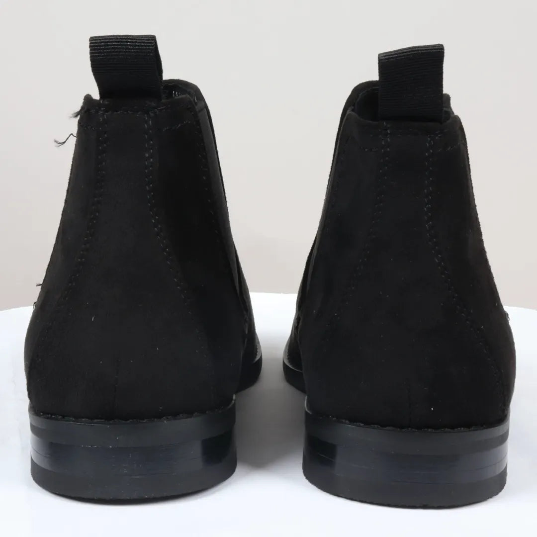 Svarta slip-on-stövlar med foder i mocka och läder för män